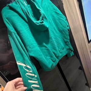 Victoria's Secret green Zip-Up Sweater with Embroidered Crest